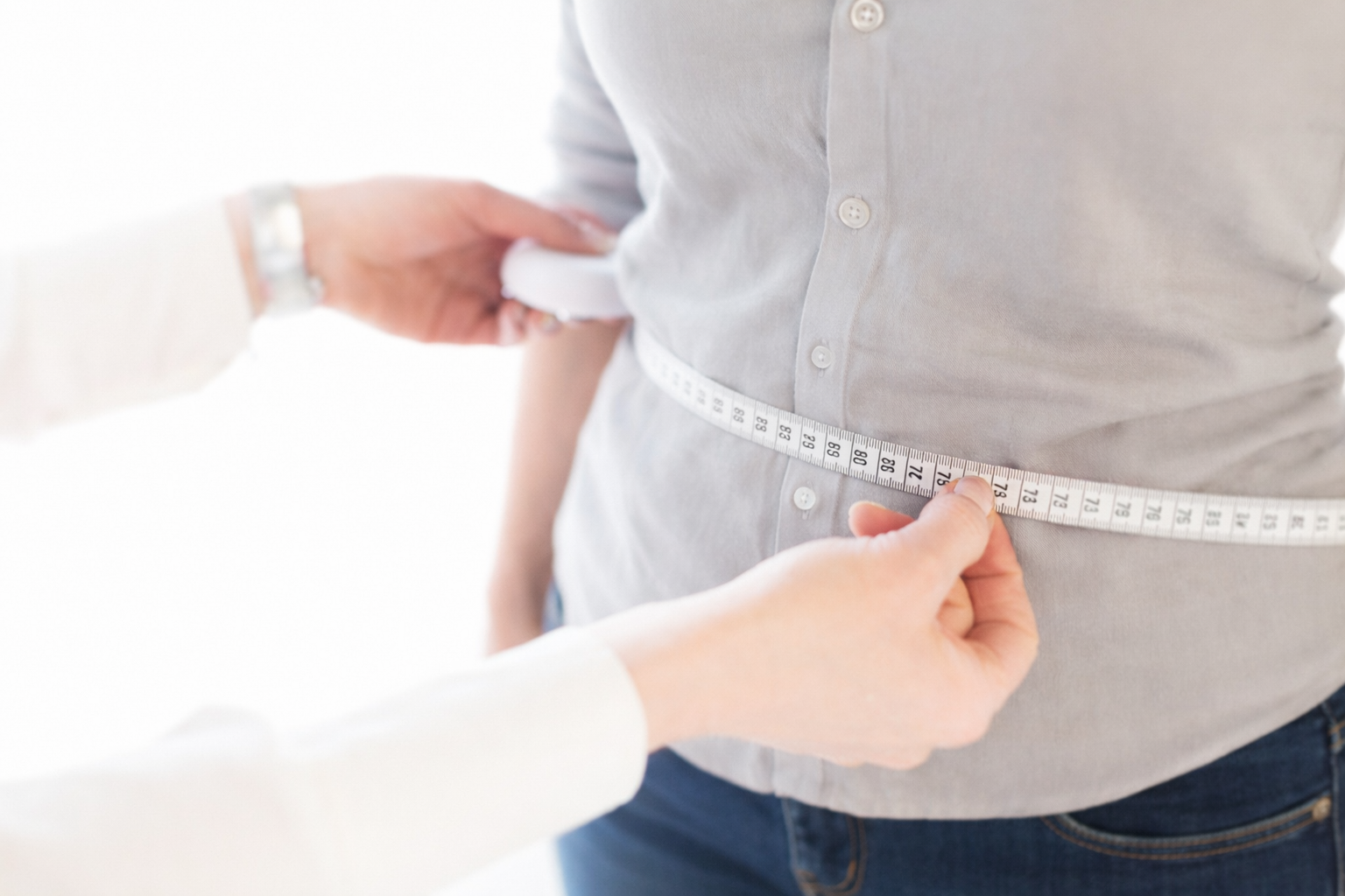 Gabi taking measurements during a consultation